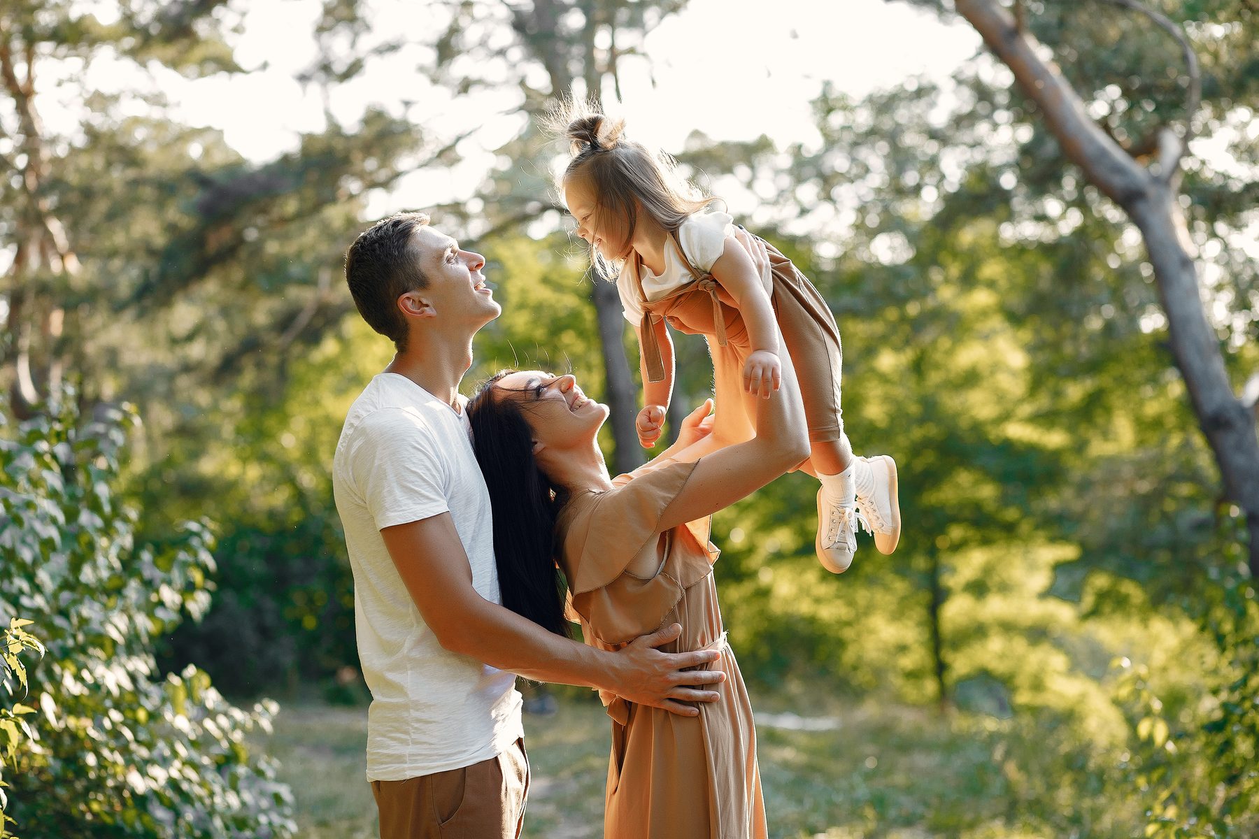 Family playing together outdoors in Bergen County